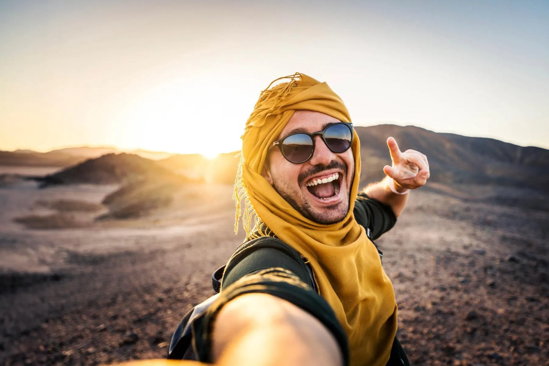 boytakingselfieindesertsafari